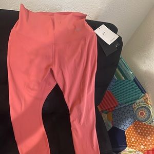 Brand New Nike leggings peachy color size small!